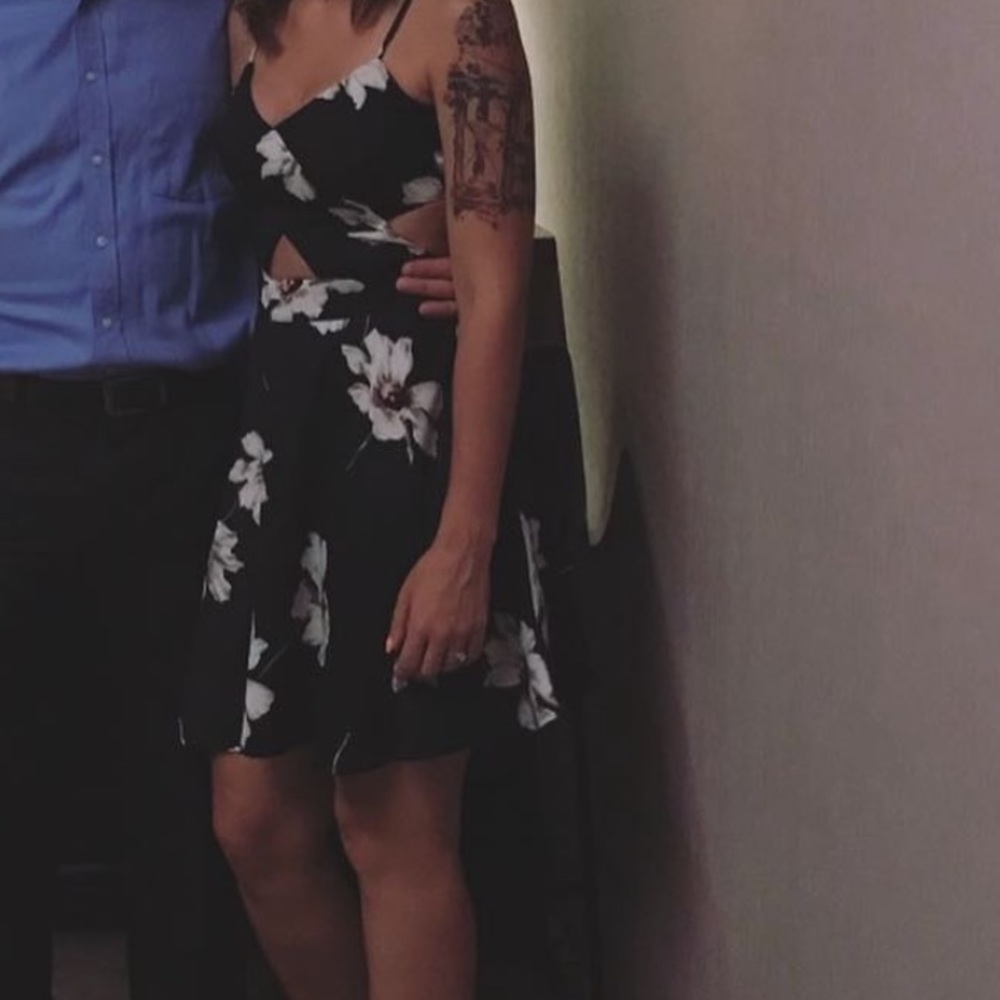 Black floral dress with cut out details.